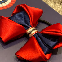 Luxury Bows: Rich red satin bows with Navy central design