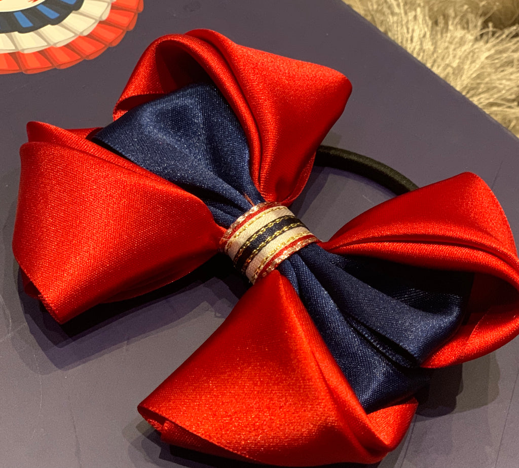 Luxury Bows: Rich red satin bows with Navy central design