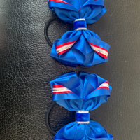 Luxury Bows: Royal blue and red twist bows